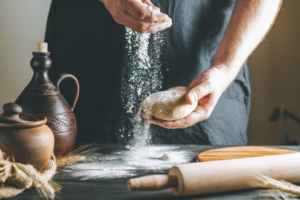 person making bread