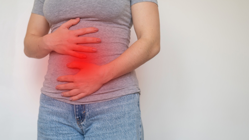 women with red mark around emphasizing pelvic pain