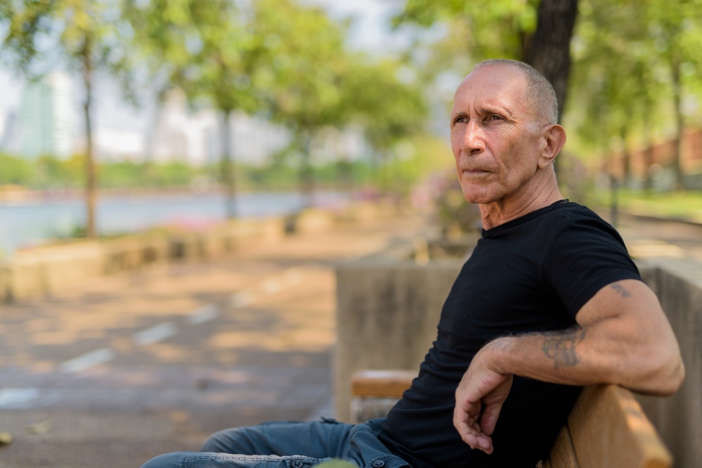 male sitting on a bench